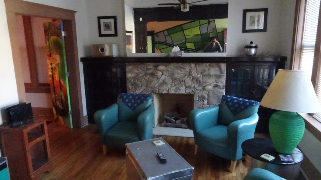 Living room with two chairs and a fireplace